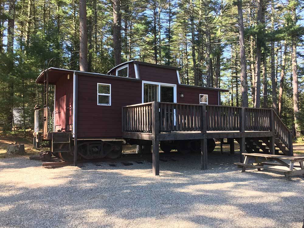 One of the rental cabins with a deck at NATURES CAMPSITES