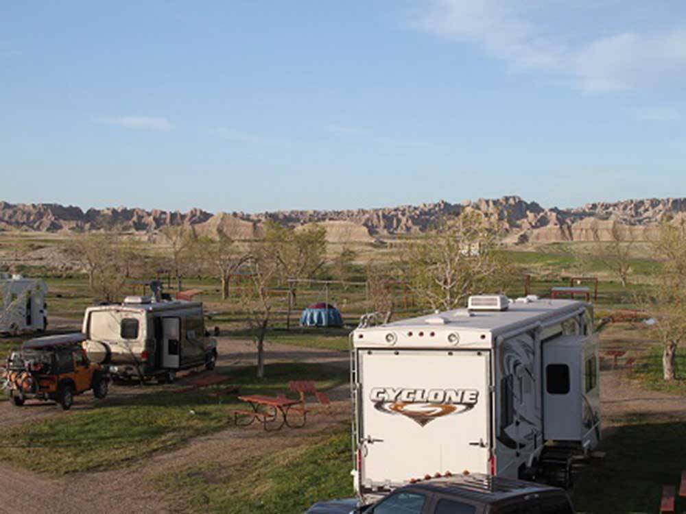 RVs parked near mountains at BADLANDS MOTEL & CAMPGROUND