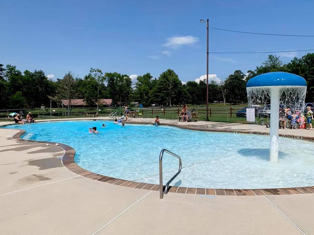 People in the pool with a fountain