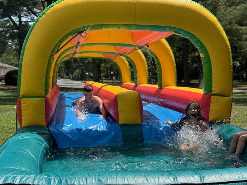 Children playing on a water tube ride