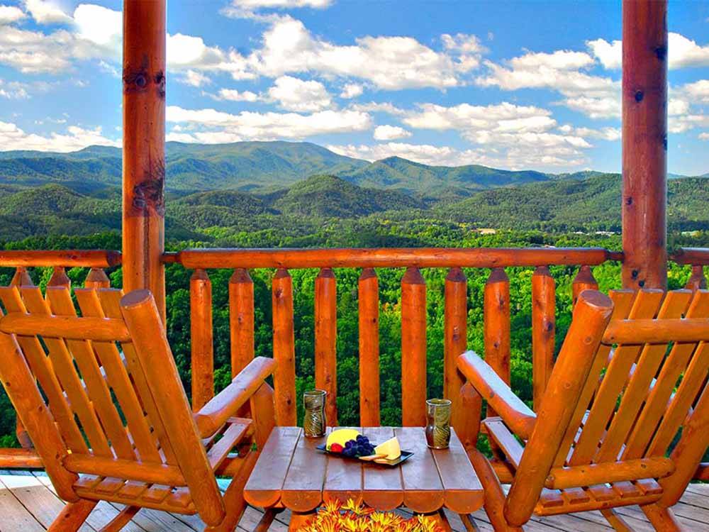 A couple of wooden chairs overlooking the valley at GREENBRIER CAMPGROUND