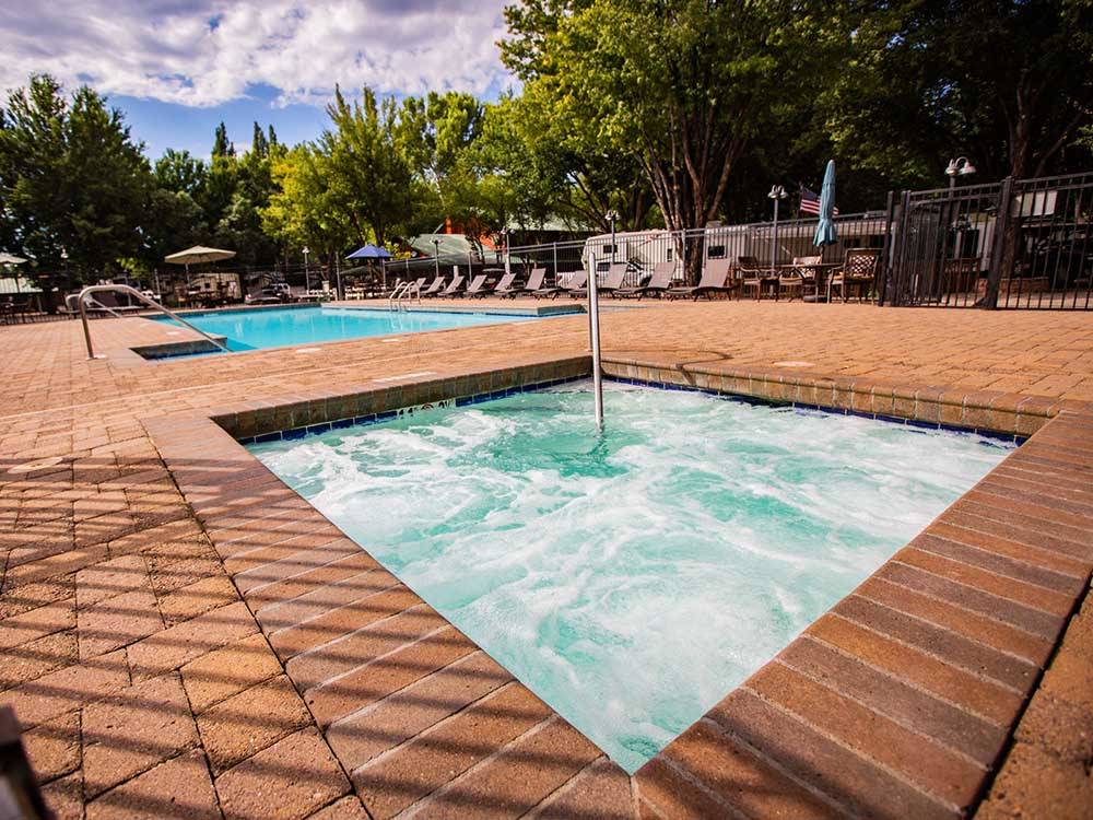 The swimming pool and spa at MUNDS PARK RV RESORT