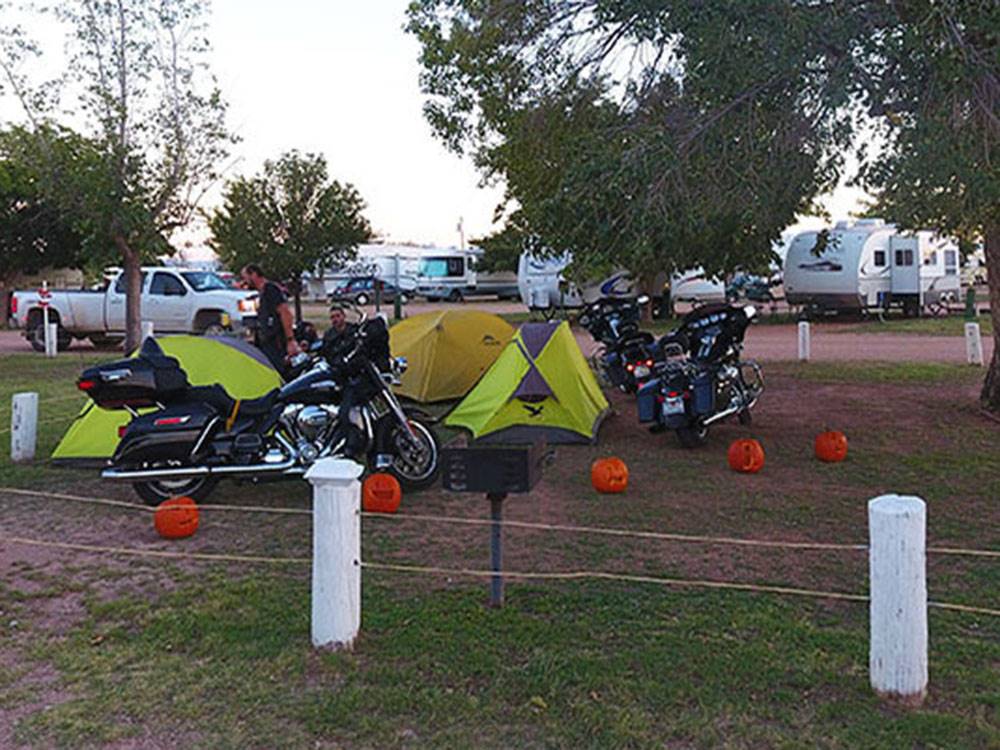Motorcycles parked in the tent sites at VAN HORN RV PARK