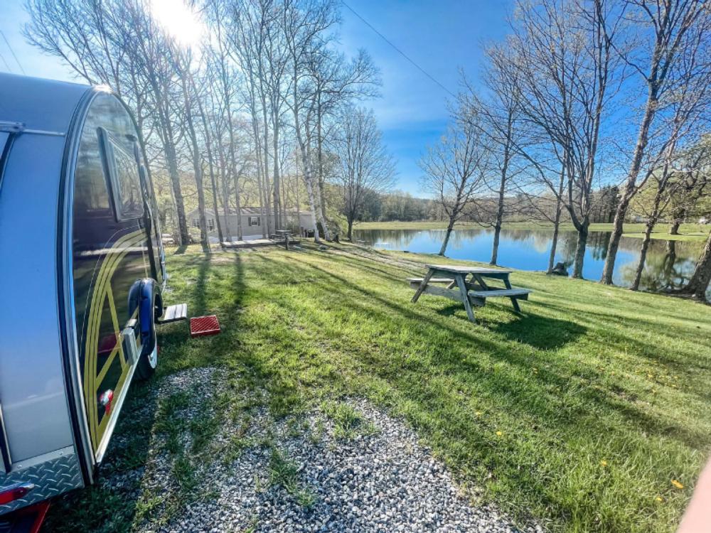 Vintage trailer by the lake at Spacious Skies Woodland Hills Campground
