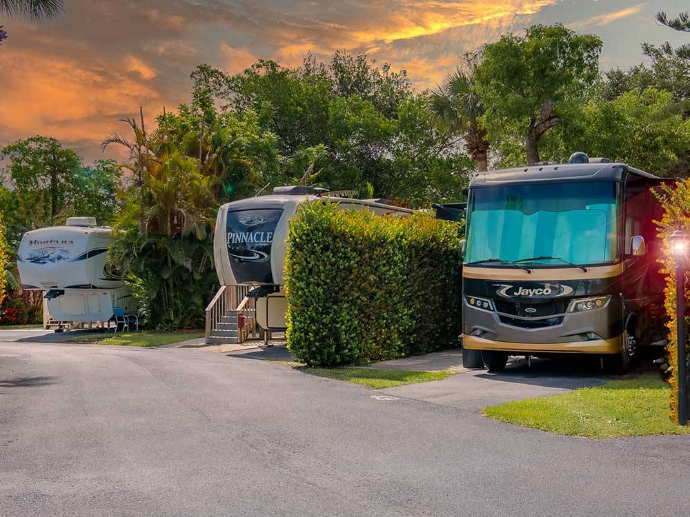 RVs separated by manicured shrubbery at NORTHTIDE NAPLES RV RESORT
