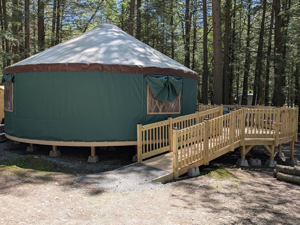 A large yurt with a deck