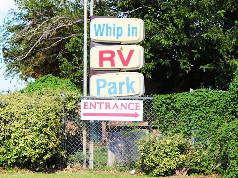 Campground signs near entrance at WHIP IN RV PARK