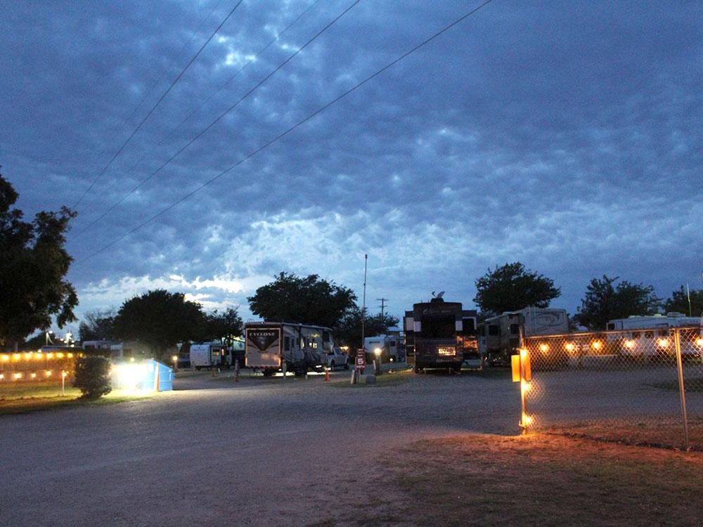 Campground and RVs at night with lights at WHIP IN RV PARK