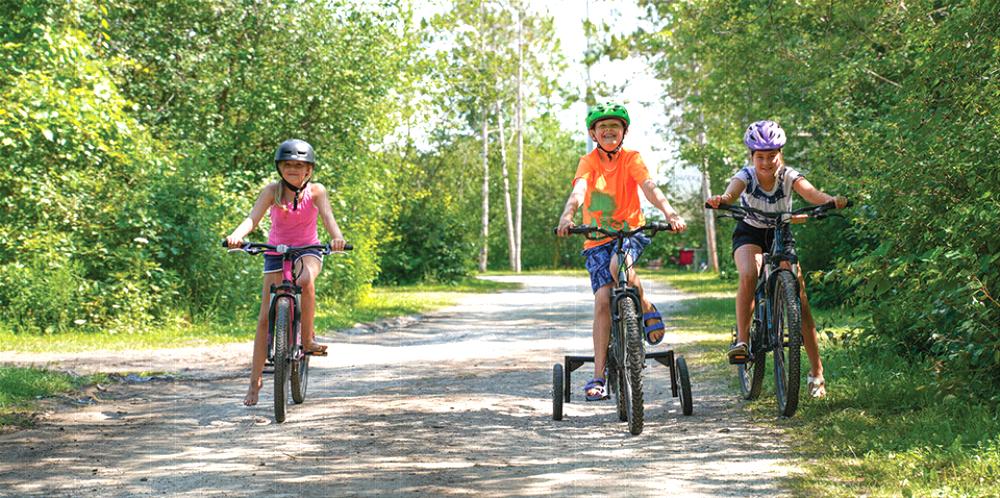 Kids riding bikes at campground