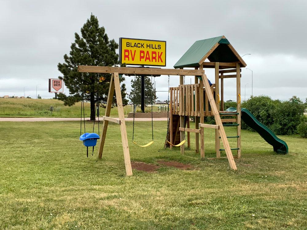 Wooden play structure at the playground at BLACK HILLS RV PARK