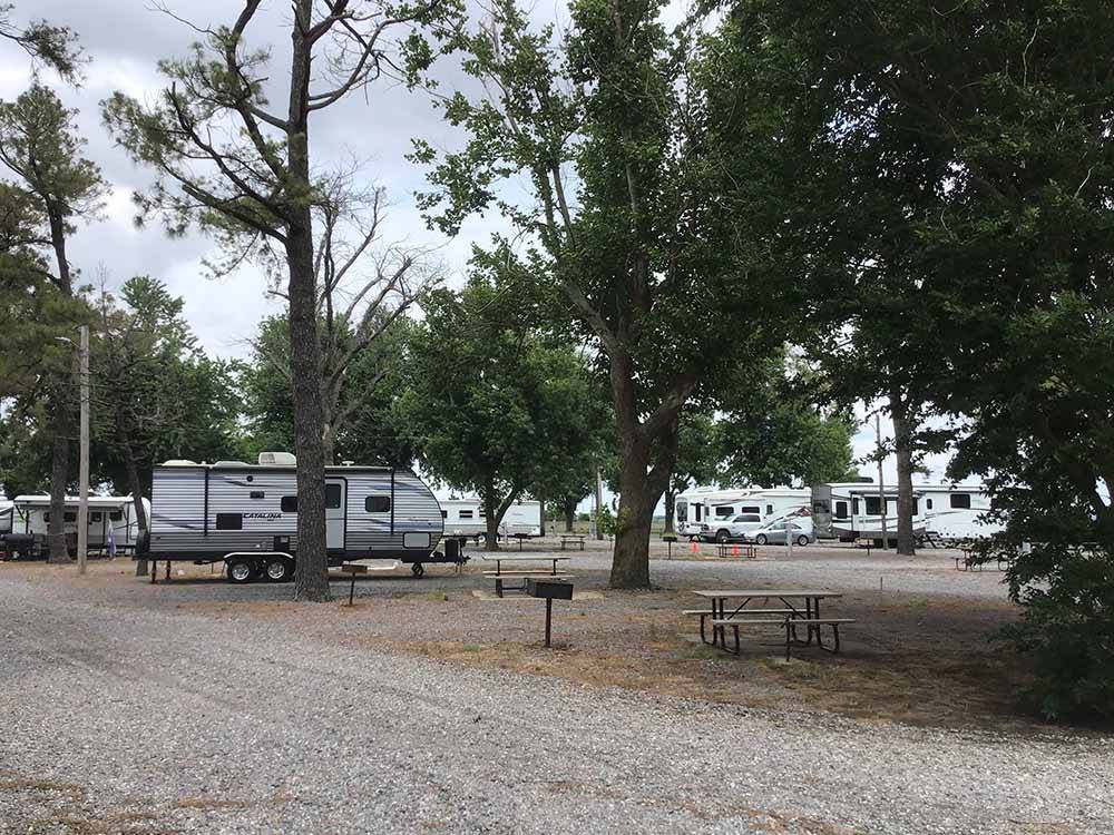 A row of gravel RV sites at BOOTHEEL RV PARK & EVENT CENTER