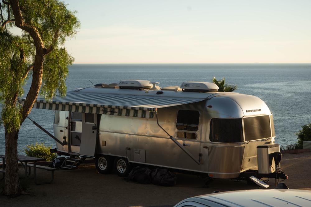 Airstream parked in a site by the ocean