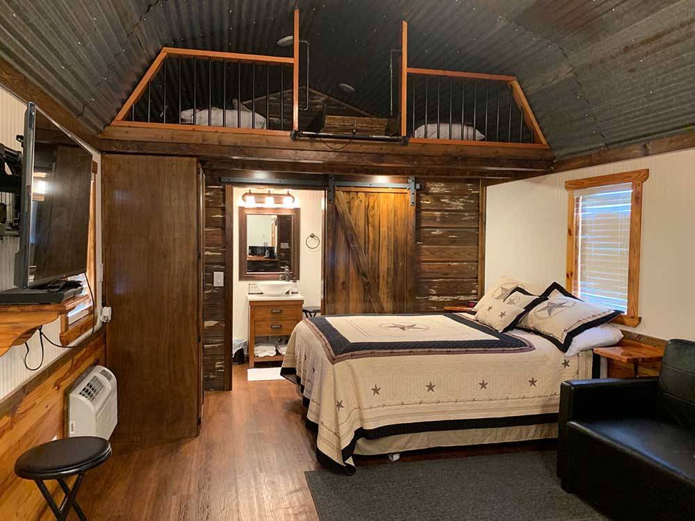 The inside of one of the log cabins at ABILENE RV PARK