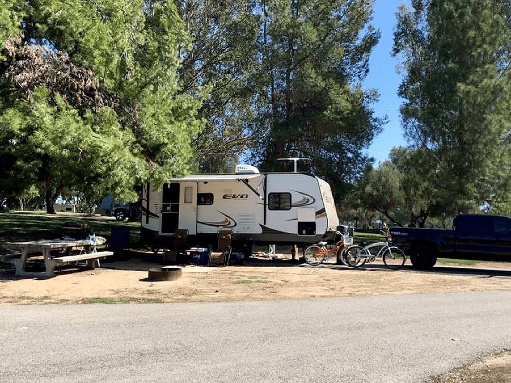 RV parked under trees