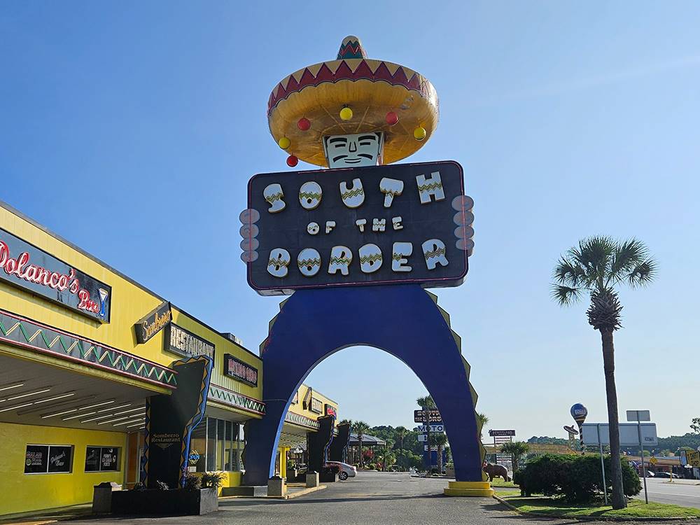 Large sign and restaurants at Camp Pedro Campground