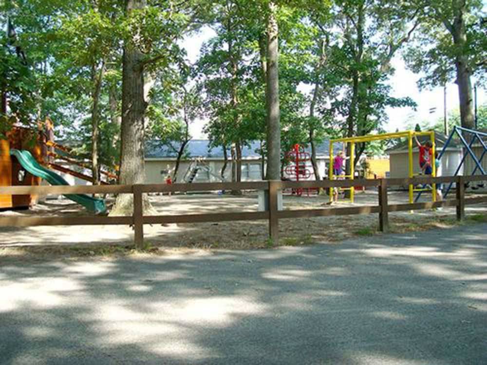 Playground with swing set at BIG OAKS FAMILY CAMPGROUND