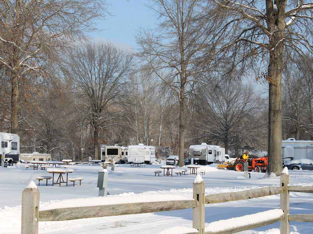 RVs and trailers camping in the snow at HUNTINGTON FOX FIRE KOA
