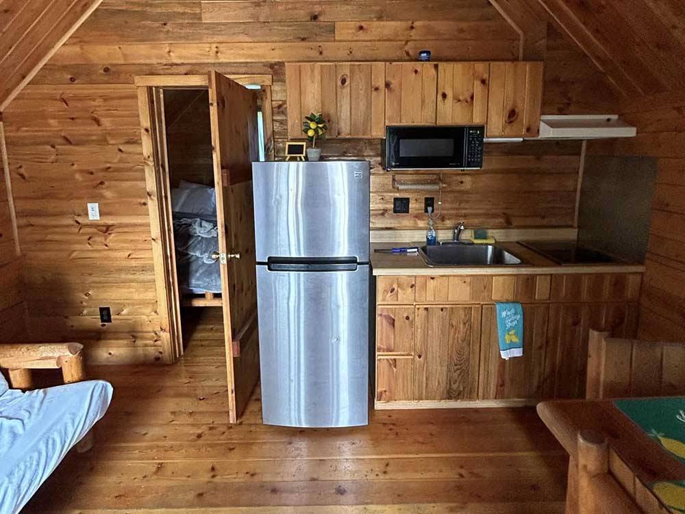 The kitchen area in the cabin rental at MERAMEC CAMPGROUND