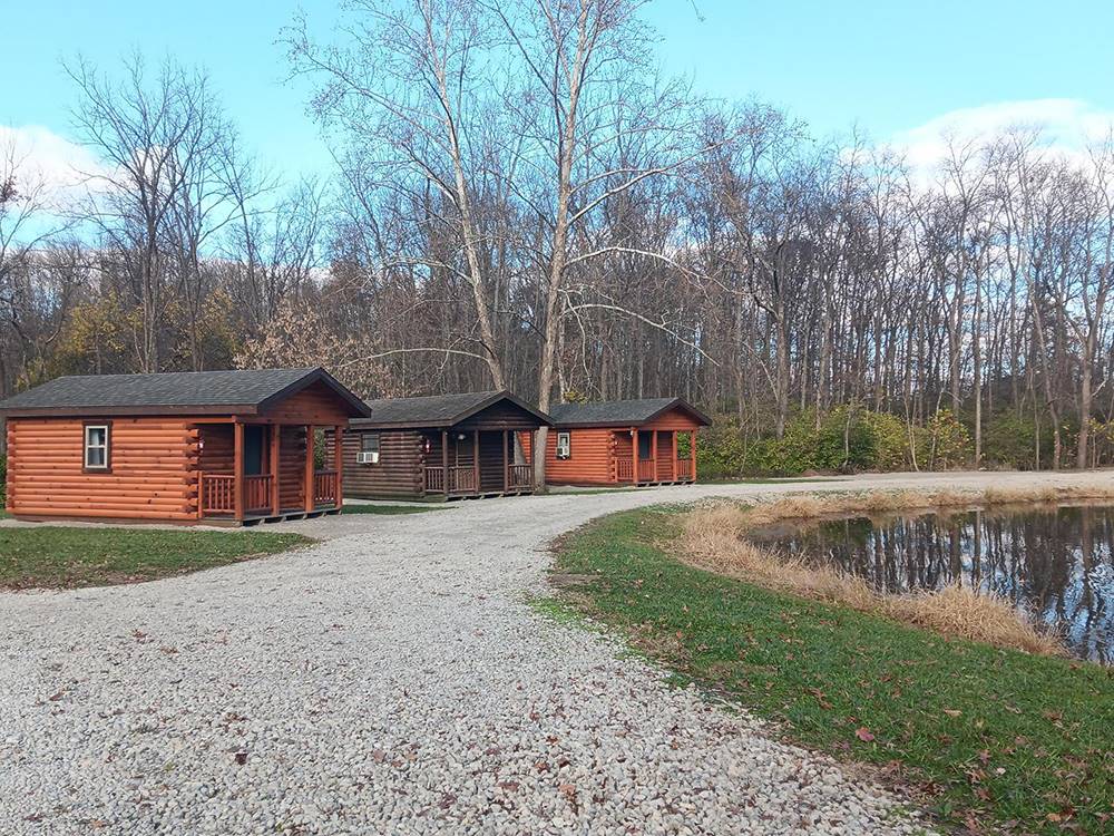 A gravel road leading to cabins
