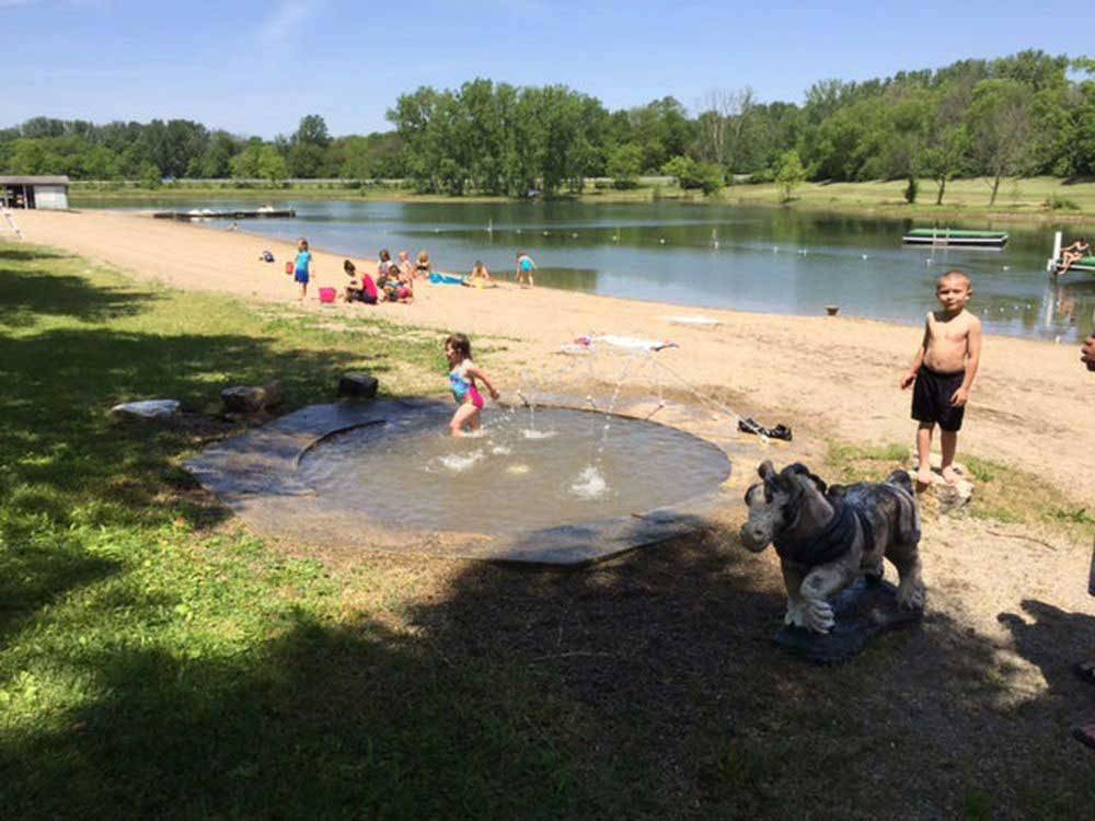 Kids playing on the shore at ENON BEACH CAMPGROUND