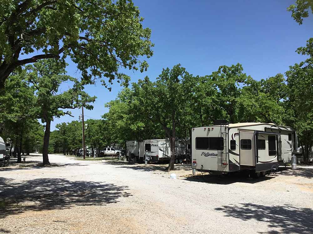 A row of gravel RV sites at CAMPER'S PARADISE RV PARK