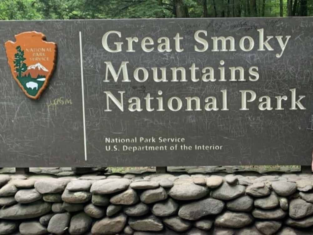 The Great Smoky Mountains National Park sign nearby at HAPPY HOLIDAY CAMPGROUND