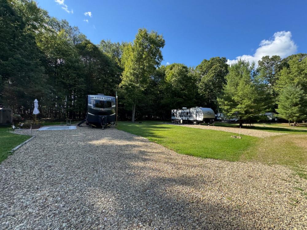 RVs in large, shaded gravel sites
