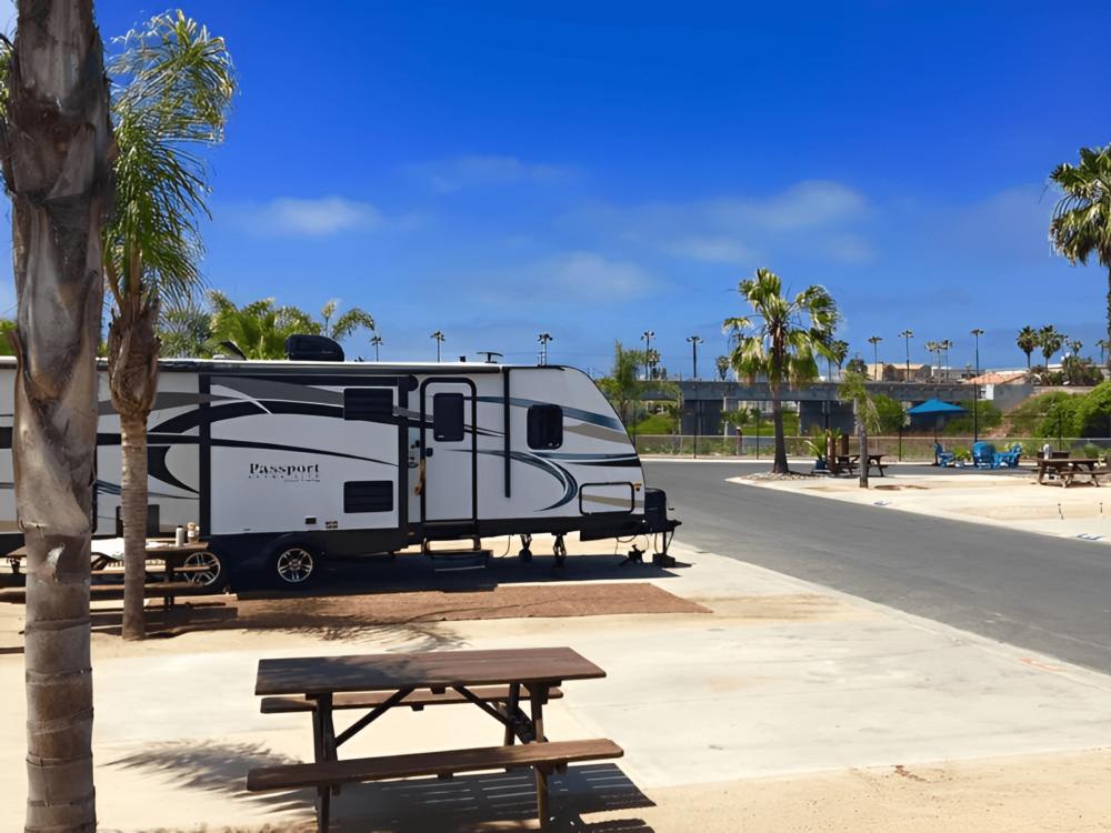 An RV parked in a paved site
