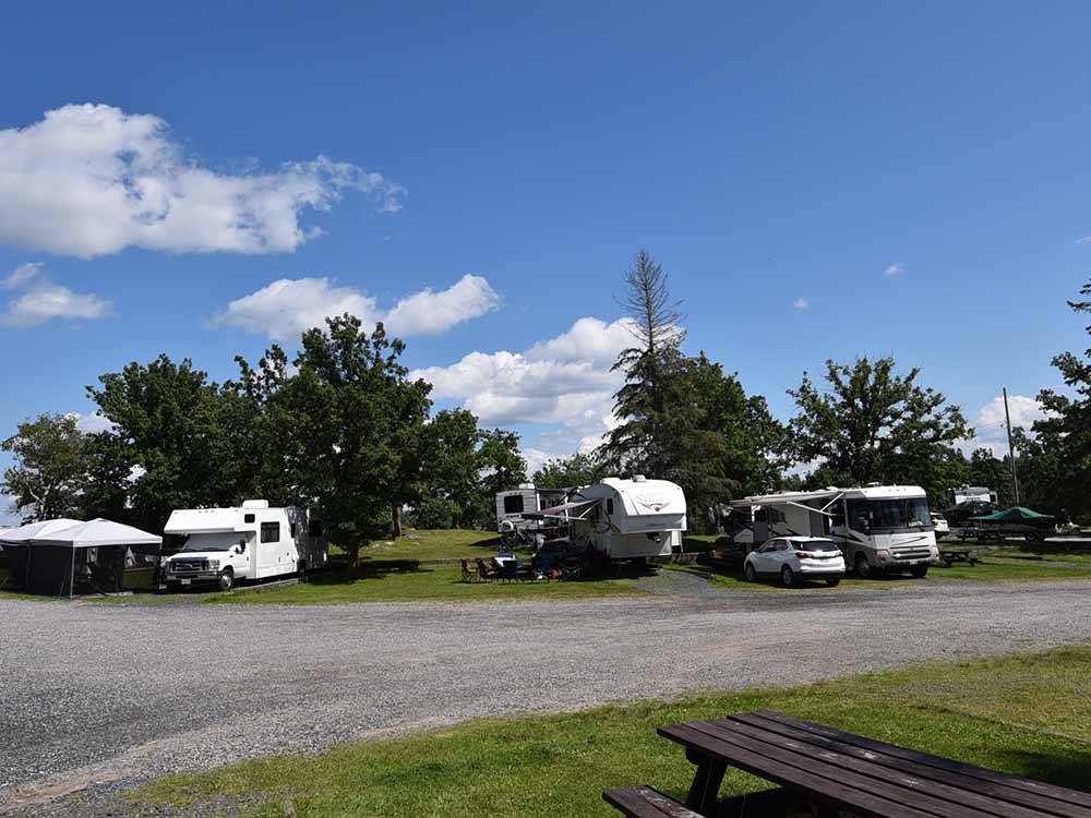 A row of motorhomes and trailers parked at ANICINABE PARK