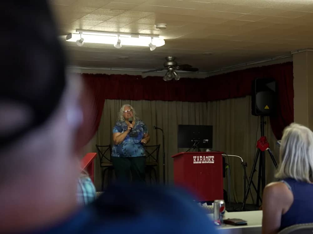 A lady singing karaoke