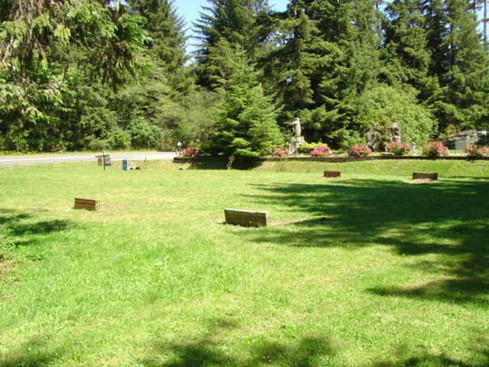 Horseshoe pits in the grass at MYSTIC FOREST RV PARK