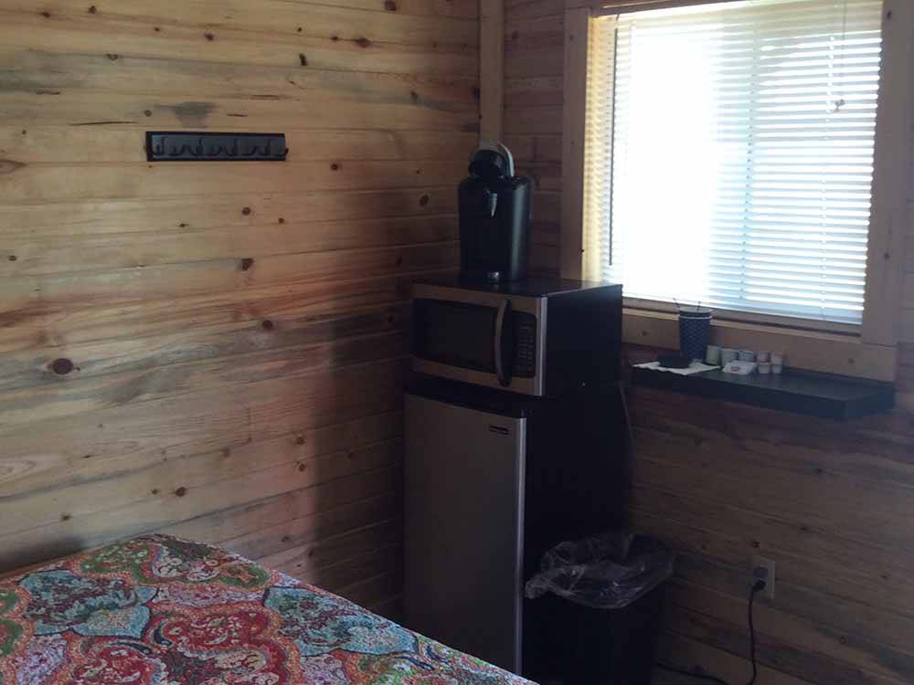 The microwave and refrigerator in the rental cabin at CEDAR BREAKS RV PARK