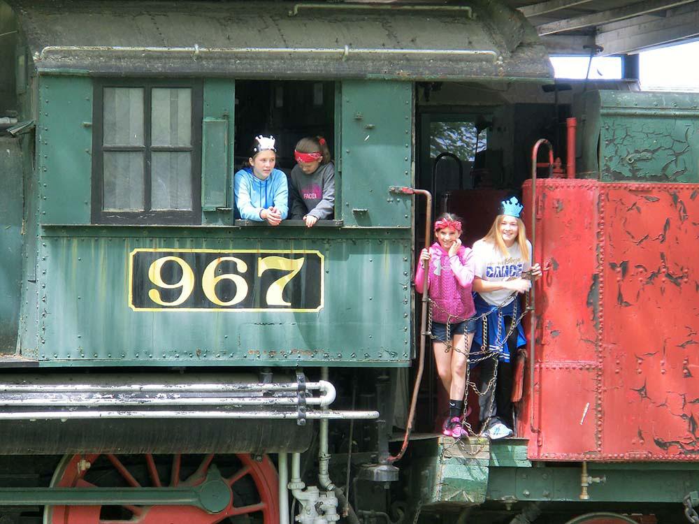 Kids on vintage train at PIONEER VILLAGE CAMPGROUND