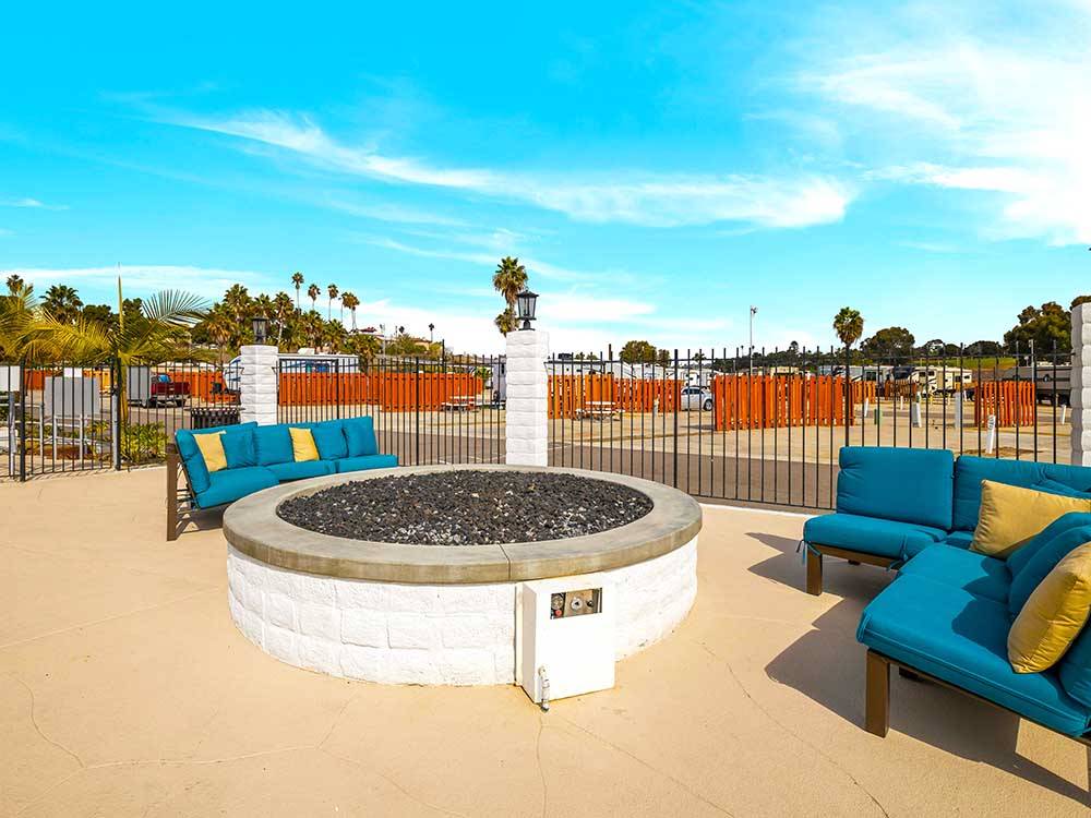 A large swimming pool with lounge chairs at OCEANSIDE RV RESORT