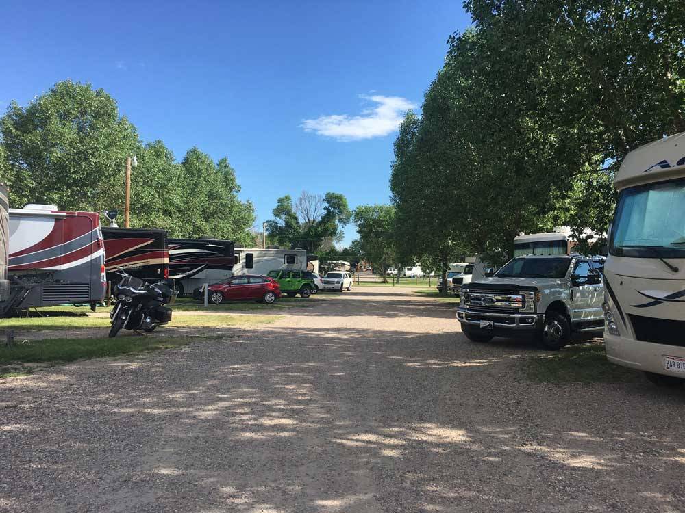 Gravel road with gravel RV sites at AB CAMPING RV PARK