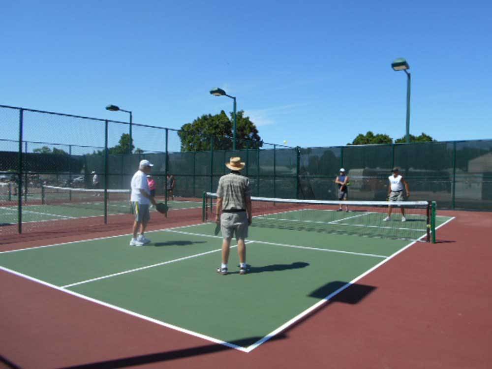 A group of people playing pickleball at SUNDANCE RV RESORT