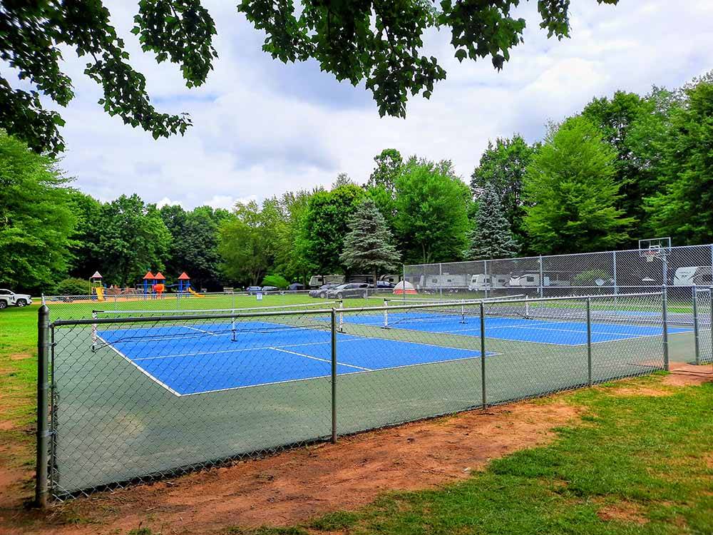 The fenced in pickleball courts at HUNGRY HORSE FAMILY CAMPGROUND