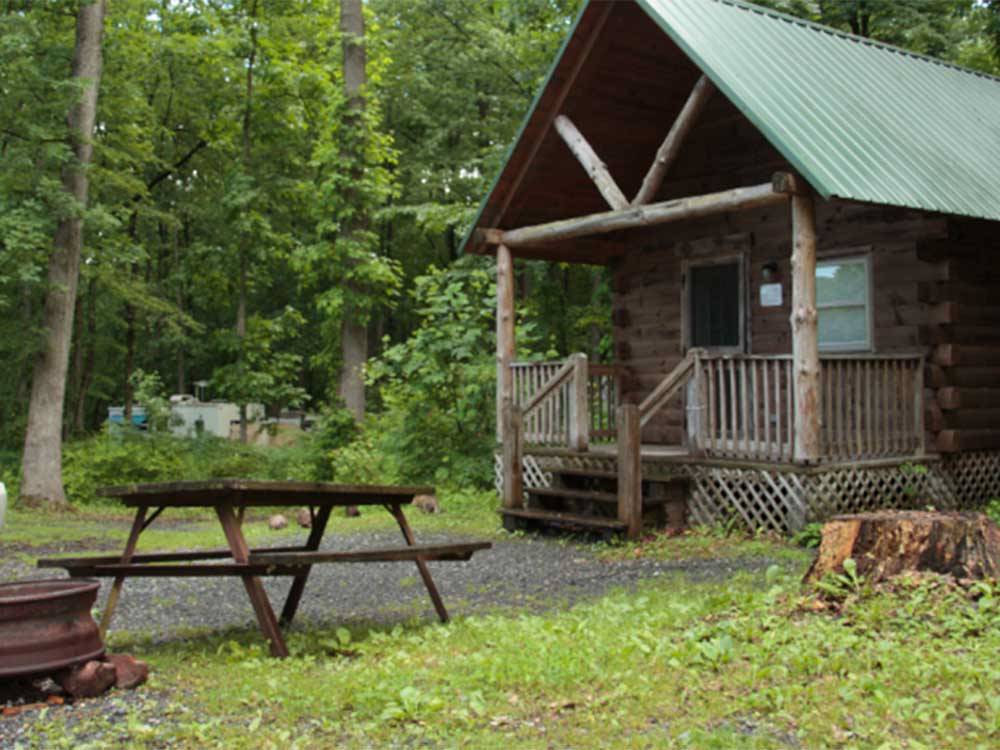 Outside a rustic rental cabin at HICKORY RUN CAMPGROUND