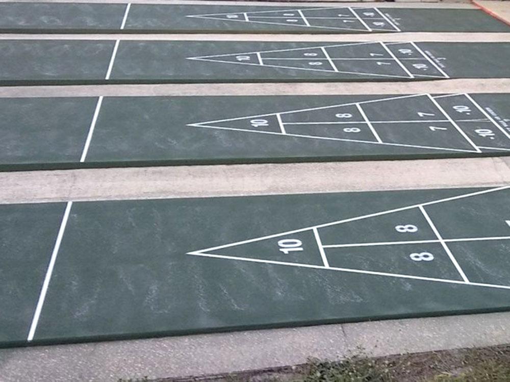 Outdoor shuffleboards at HAPPY TRAVELER RV RESORT