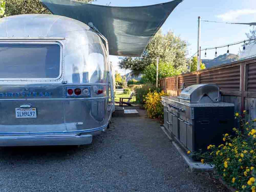 An Airstream in a gravel RV site at FLYING FLAGS RV RESORT & CAMPGROUND