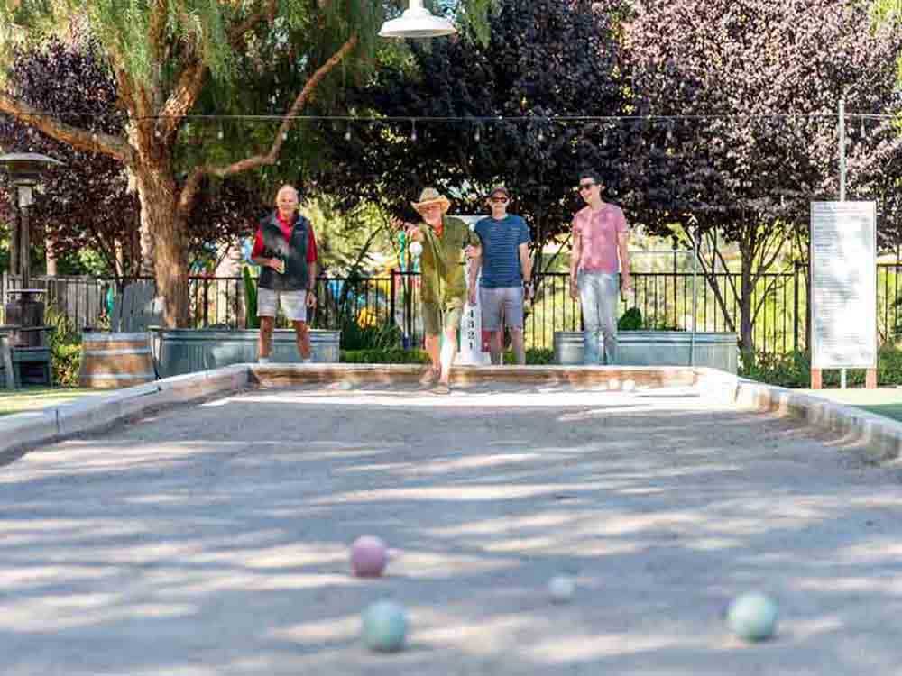 A group of people playing bocce ball at FLYING FLAGS RV RESORT & CAMPGROUND