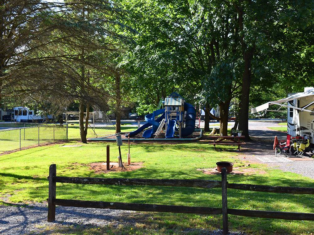 The playground next to a site at PINCH POND FAMILY CAMPGROUND