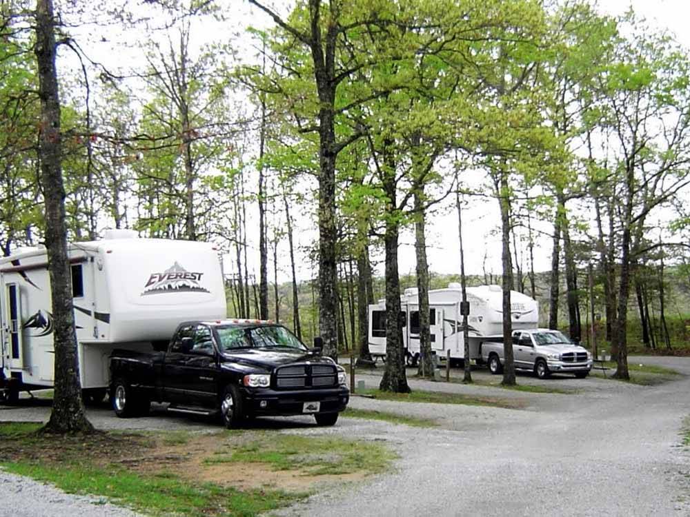 Two fifth wheel trailers backed in at RV spaces at BEAN POT CAMPGROUND