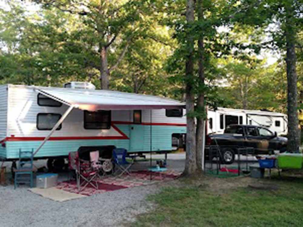 A fifth wheel trailer in a gravel spot at BEAN POT CAMPGROUND