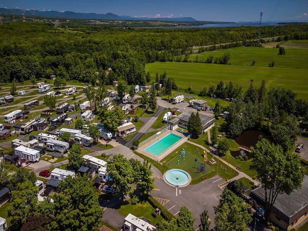 Aerial view of campground with pool and trees at CAMPING TRANSIT, ENR.205155
