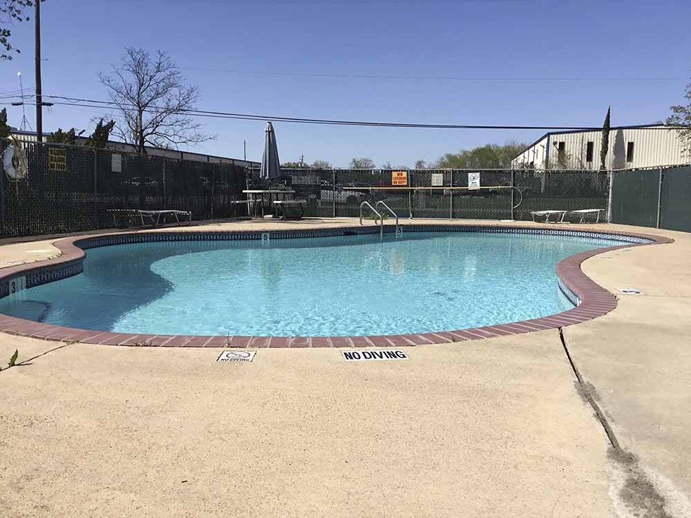 The fenced-in pool area at HOUSTON CENTRAL RV PARK