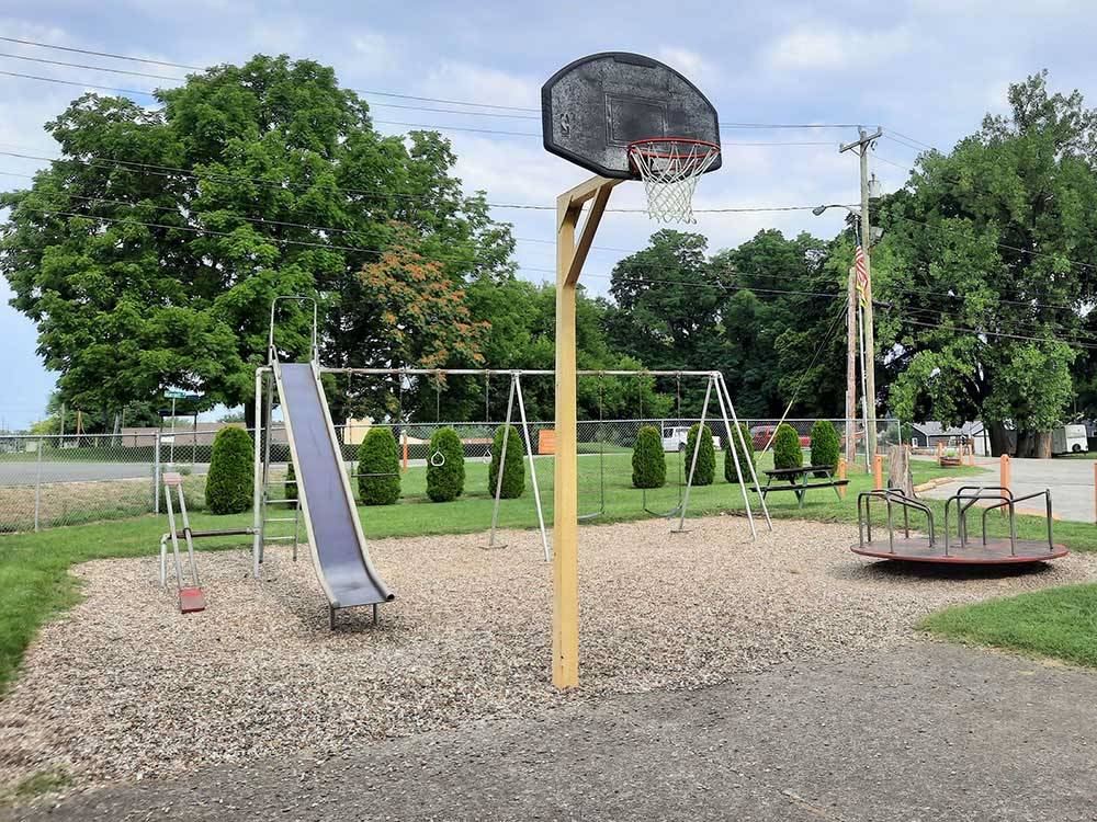 The kids play area and basketball court at LOUISVILLE NORTH CAMPGROUND