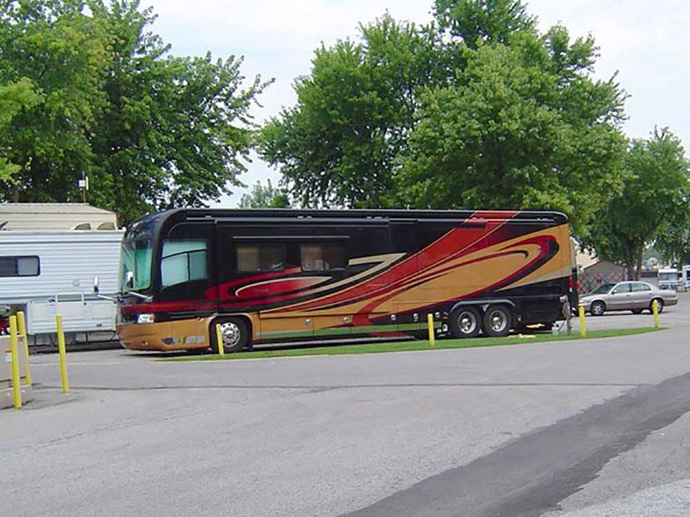 Class A motorhome in a pull thru site at LOUISVILLE NORTH CAMPGROUND