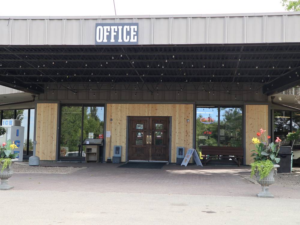 Exterior view of front office at GLOWING EMBERS RV PARK & TRAVEL CENTRE