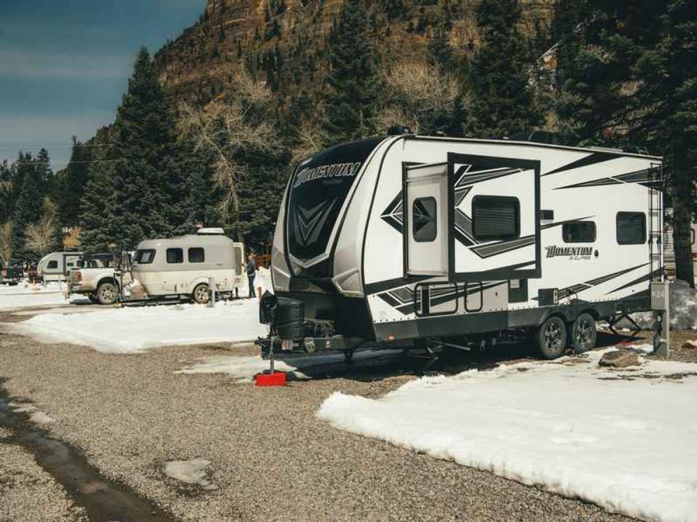 Trailers in snowy RV sites at Ouray Riverside Resort